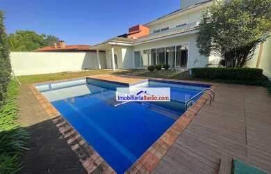 Imagem: A casa em condomínio possui 5 Dormitórios, 5 Banheiros, 4