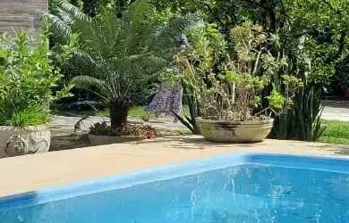 Imagem: A casa possui 3 Dormitórios, 3 Banheiros, 4 Vagas na garagem