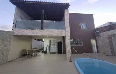 Imagem: A casa possui 3 Dormitórios, 5 Banheiros, 2 Vagas na garagem