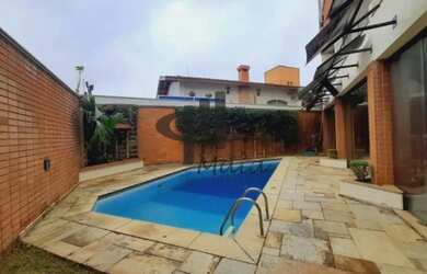 Imagem: A casa possui 5 Dormitórios, 2 Banheiros, 5 Vagas na garagem