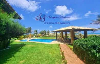 Imagem 12: Belíssima mansão no Porto das Dunas frente mar pé na areia com 8 suítes