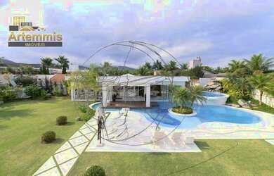 Imagem: A casa possui 4 Dormitórios, 5 Banheiros, 2.000m² de Área