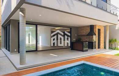 Imagem: A casa possui 4 Dormitórios, 5 Banheiros, 5 Vagas na garagem