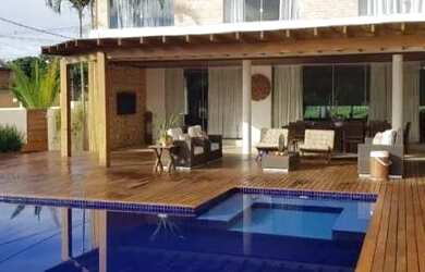 Imagem: A casa possui 4 Dormitórios, 4 Banheiros, 4 Vagas na garagem