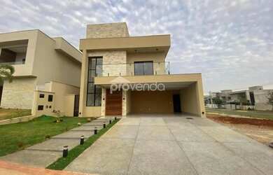 Imagem: A casa possui 3 Dormitórios, 5 Banheiros, 4 Vagas na garagem