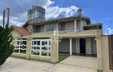 Imagem: A casa e possui 5 Dormitórios, Suítes, 5 Banheiros, 3 Vagas