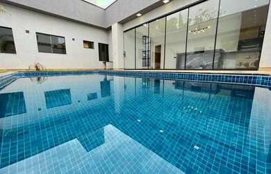 Imagem: A casa possui 3 Dormitórios, 4 Banheiros, 4 Vagas na garagem