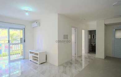 Imagem: O apartamento possui 2 Dormitórios, 1 Banheiro, 1 Vaga na garagem