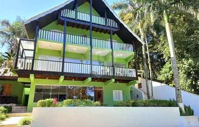 Imagem: A casa possui 3 Dormitórios, 5 Banheiros, 5 Vagas na garagem