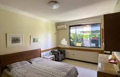 Imagem: A casa possui 4 Dormitórios, 5 Banheiros, 5 Vagas na garagem