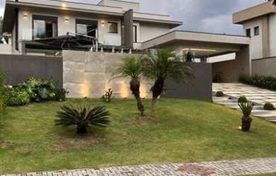 Imagem: A casa possui 4 Dormitórios, 5 Banheiros, 5 Vagas na garagem