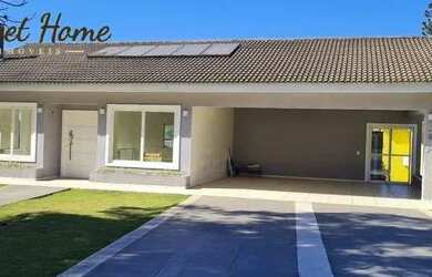 Imagem: A casa possui 4 Dormitórios, 5 Banheiros, 5 Vagas na garagem