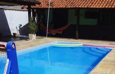 Imagem: A casa possui 3 Dormitórios, 4 Banheiros, 5 Vagas na garagem