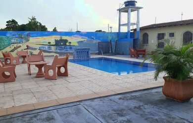 Imagem: A casa possui 3 Dormitórios, 3 Banheiros, 5 Vagas na garagem