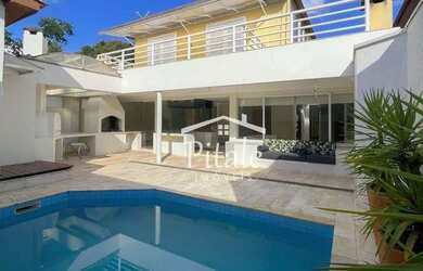 Imagem: A casa em condomínio possui 4 Dormitórios, 4 Banheiros, 2