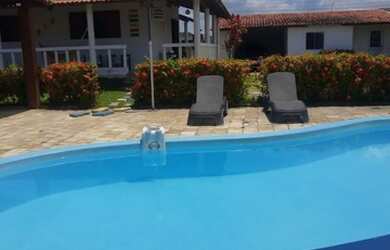 Imagem: A casa possui 4 Dormitórios, 5 Vagas na garagem e está localizado