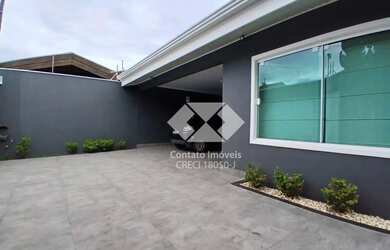 Imagem: A casa possui 3 Dormitórios, 3 Banheiros, 4 Vagas na garagem