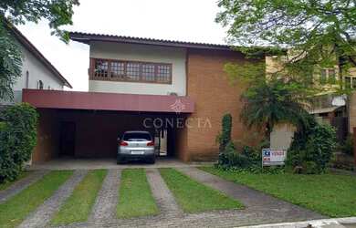Imagem: A casa possui 4 Dormitórios, 5 Banheiros, 2 Vagas na garagem