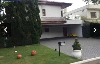 Imagem: A casa possui 4 Dormitórios, 5 Banheiros, 5 Vagas na garagem