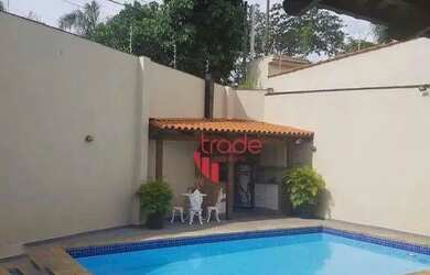 Imagem: A casa possui 3 Dormitórios, 4 Banheiros, 5 Vagas na garagem