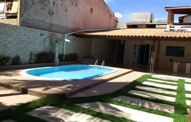 Imagem: A casa possui 3 Dormitórios, 4 Banheiros, 3 Vagas na garagem