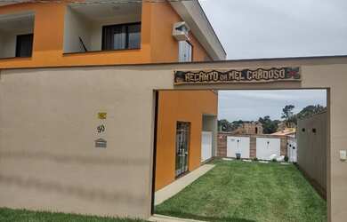 Imagem: A casa possui 3 Dormitórios e 4 Vagas na garagem e está localizado