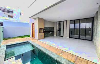 Imagem: A casa possui 3 Dormitórios, 5 Banheiros, 4 Vagas na garagem