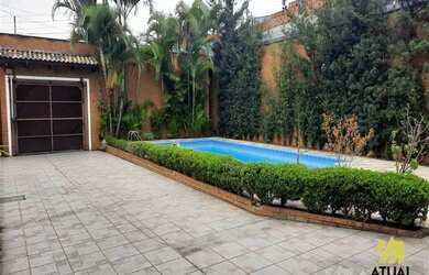 Imagem: A casa possui 3 Dormitórios, 4 Banheiros, 5 Vagas na garagem