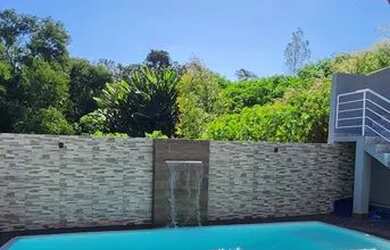 Imagem: A casa possui 3 Dormitórios, 4 Banheiros, 3 Vagas na garagem