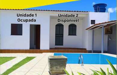 Imagem: A casa possui 2 Dormitórios, 1 Banheiro, 2 Vagas na garagem