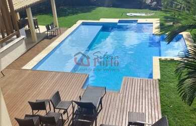 Imagem: A casa possui 4 Dormitórios, 5 Banheiros, 1 Vaga na garagem