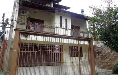 Imagem: A casa possui 3 Dormitórios, 3 Banheiros, 5 Vagas na garagem