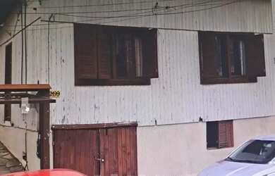 Imagem: A casa possui 2 Dormitórios, 1 Banheiro, 1 Vaga na garagem