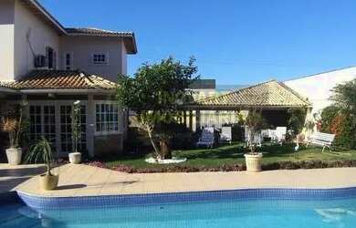 Imagem: A casa possui 5 Dormitórios, 5 Banheiros, 4 Vagas na garagem