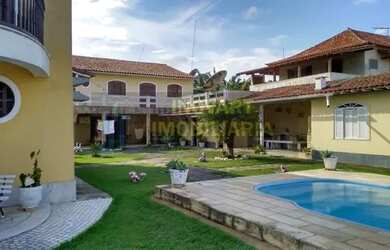 Imagem: A casa possui 5 Dormitórios, 5 Banheiros, 5 Vagas na garagem