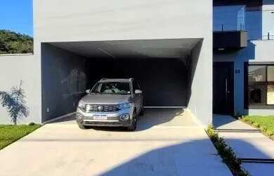 Imagem: A casa possui 5 Dormitórios, 5 Banheiros, 4 Vagas na garagem