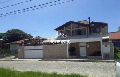 Imagem: A casa possui 5 Dormitórios, 5 Banheiros, 5 Vagas na garagem