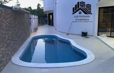 Imagem: A casa em condomínio possui 5 Dormitórios, 5 Banheiros, 4