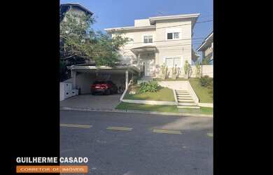 Imagem: A casa possui 4 Dormitórios, 5 Banheiros, 4 Vagas na garagem