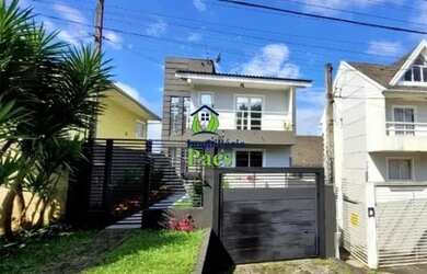 Imagem: A casa possui 2 Dormitórios, 2 Banheiros, 3 Vagas na garagem