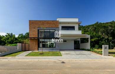 Imagem: A casa em condomínio à venda possui 4 Dormitórios, 4 Banheiros