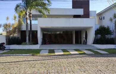 Imagem: A casa possui 3 Dormitórios, 5 Banheiros, 3 Vagas na garagem