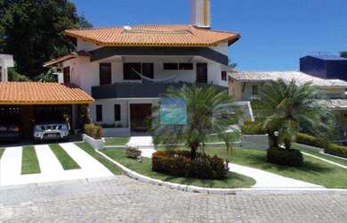 Imagem: A casa possui 4 Dormitórios, 4 Banheiros, 4 Vagas na garagem