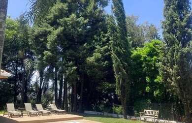 Imagem: A casa em condomínio possui 4 Dormitórios, 5 Banheiros, 4