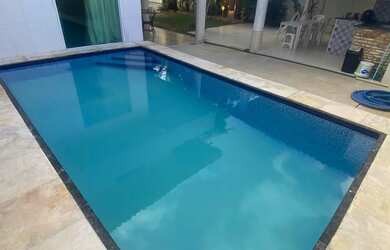 Imagem: A casa possui 3 Dormitórios, 4 Banheiros, 3 Vagas na garagem