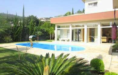 Imagem: A casa possui 5 Dormitórios, 5 Banheiros, 5 Vagas na garagem