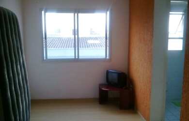 Imagem: O apartamento possui 2 Dormitórios, 1 Banheiro, 1 Vaga na garagem