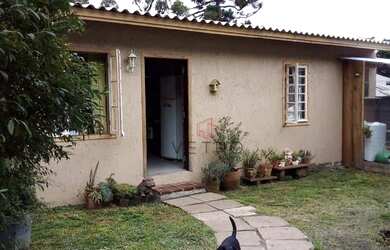 Imagem: A casa possui 3 Dormitórios, 1 Banheiro, 1 Vaga na garagem