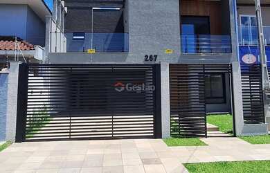 Imagem: A casa possui 3 Dormitórios, 4 Banheiros, 4 Vagas na garagem