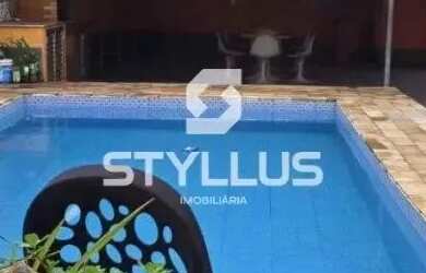 Imagem: A casa possui 5 Dormitórios, 5 Banheiros, 4 Vagas na garagem